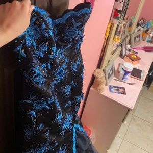 Beautiful detailed black and blue dress.